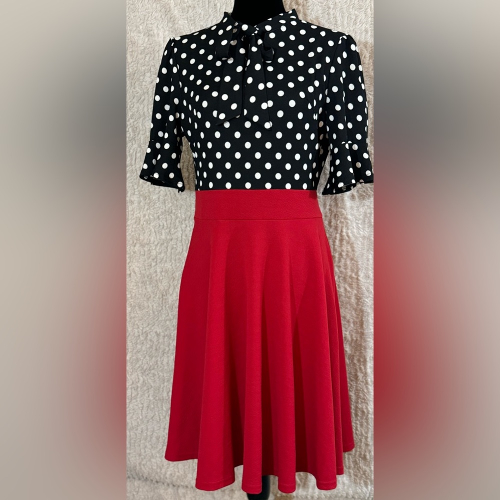 Ranphee- Retro, Polka dot black and white dress with red skirt.  Ruffle Sleeve.